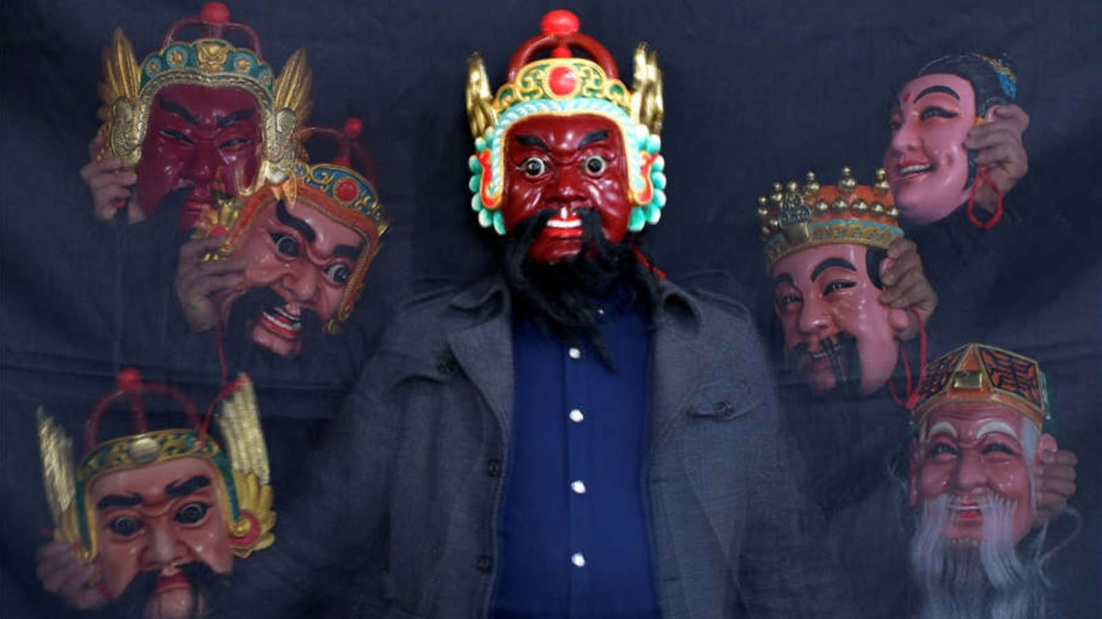 Authentic carved wooden Chinese Nuo opera exorcism mask representing ancient demon quelling rites